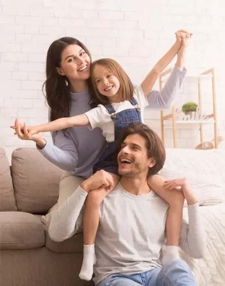 Happy family celebrating together - representing financial security and dreams achieved